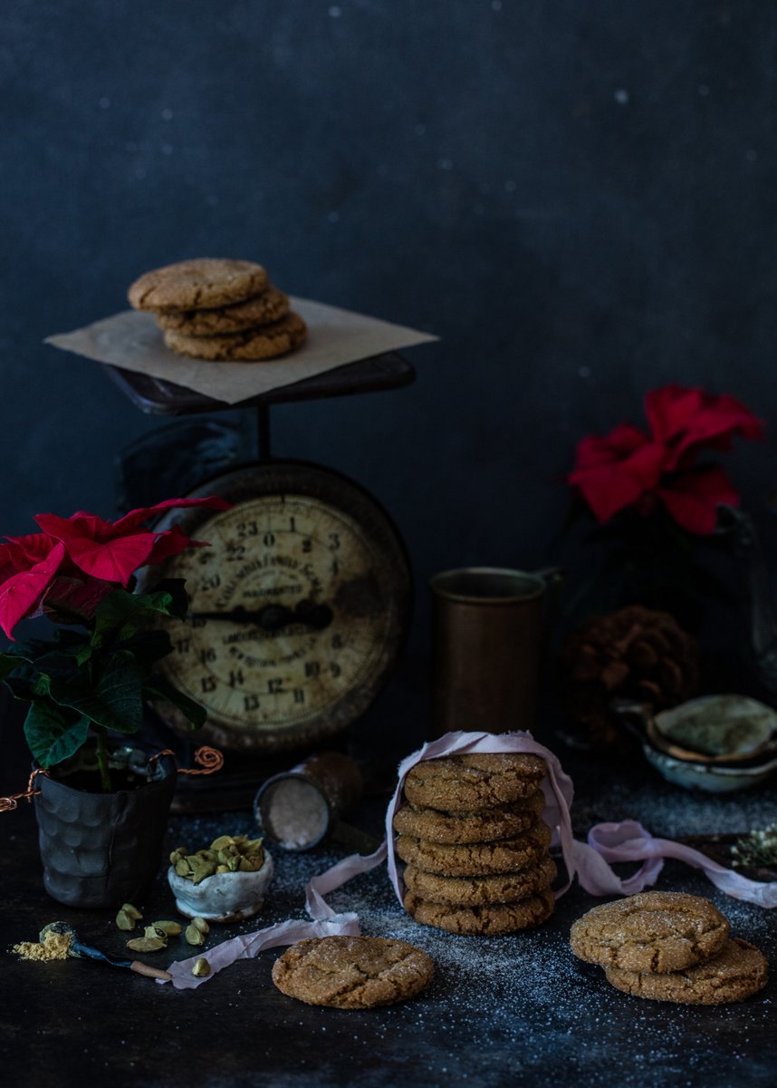 Gingersnap cookies with vintage scale and poinsettias.