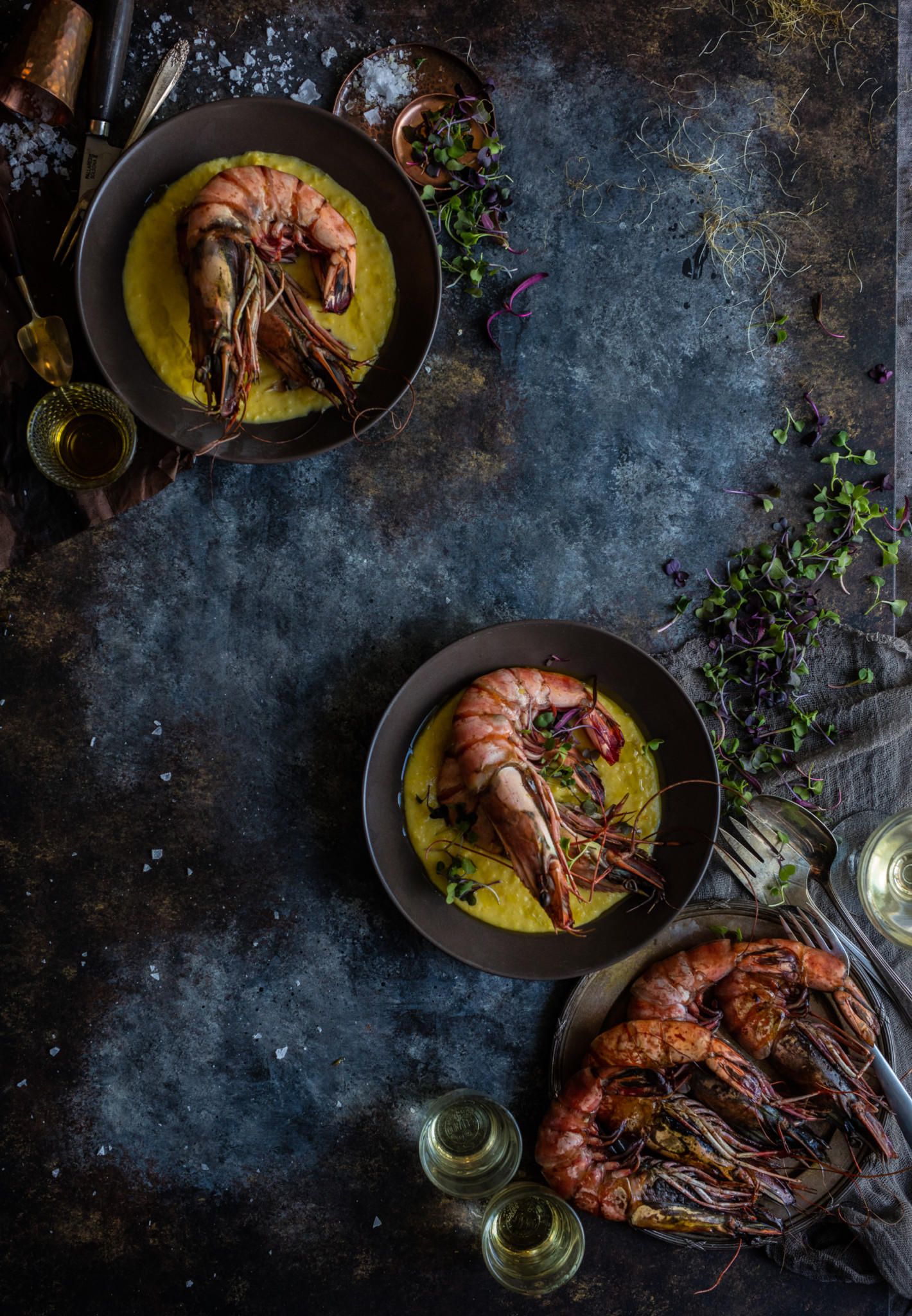 large prawns in Corn Nage with basil oil in elegant food styling