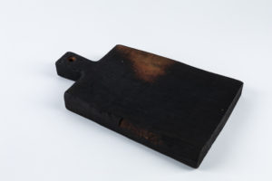 Small black cutting board prop