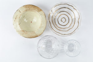 Handmade (upper left) and glass bowls for propping food photography