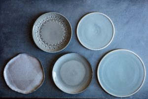 Blue and gray plates and bowls for food photo shoots