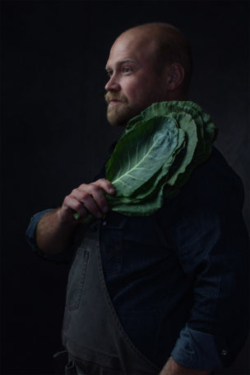 Beautiful photo of chef with collard greens photographed in Vermeer Dutch Light